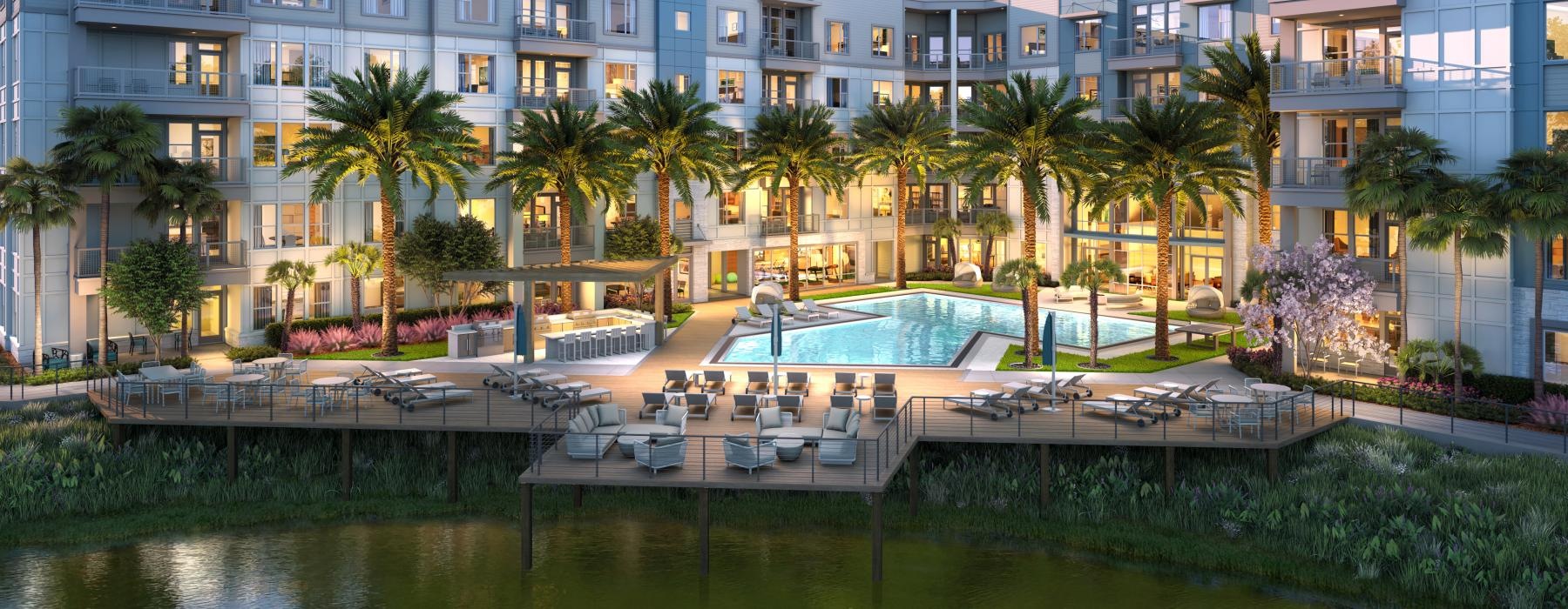 ac courtyard with a pool, palm, trees, and lounge chairs