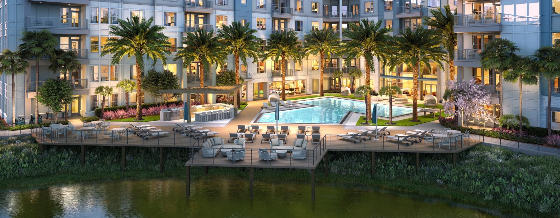 ac courtyard with a pool, palm, trees, and lounge chairs